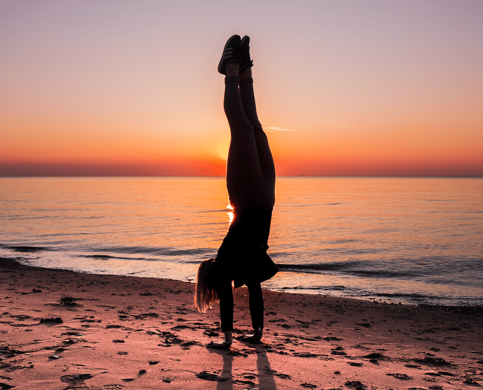 handstand on the beach