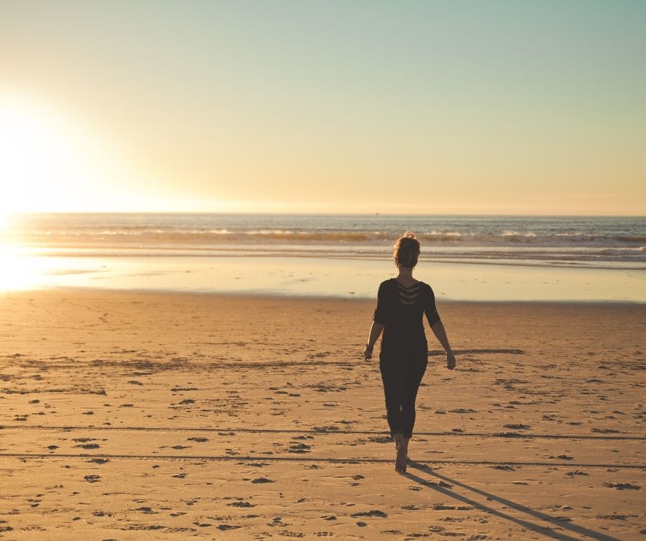 Lady walking on the beach