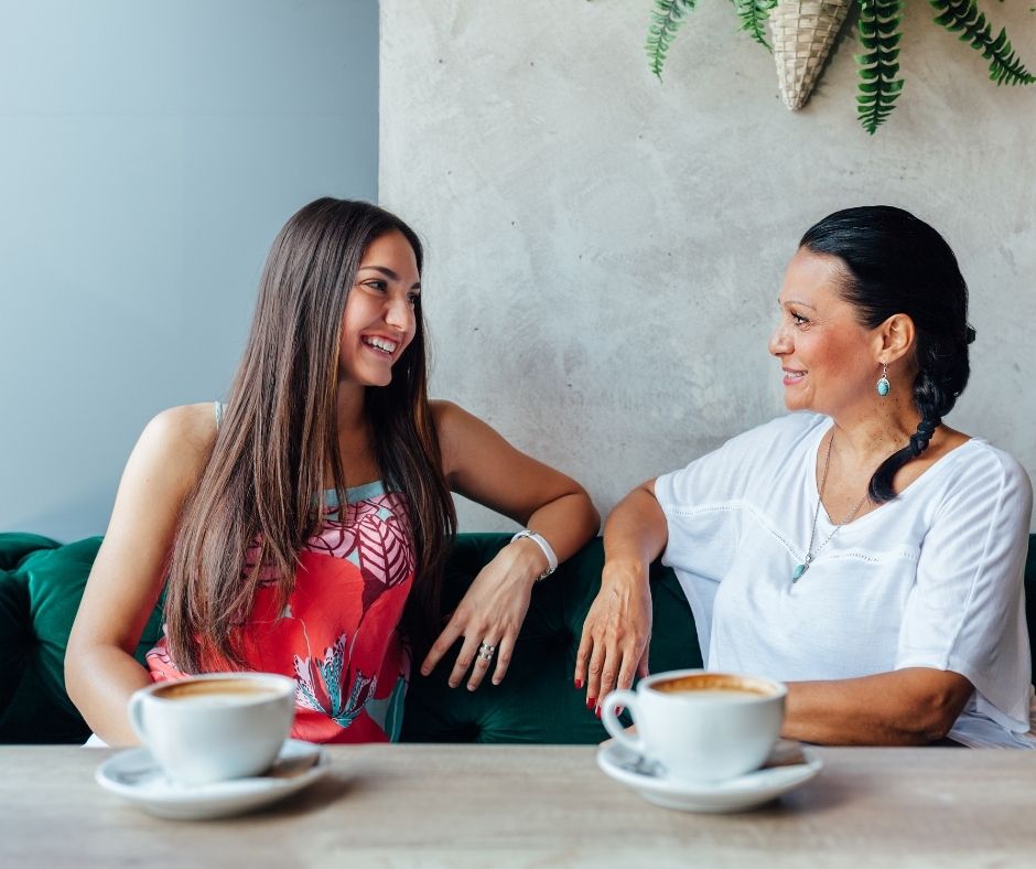 Mother and daughter communication with coffee.